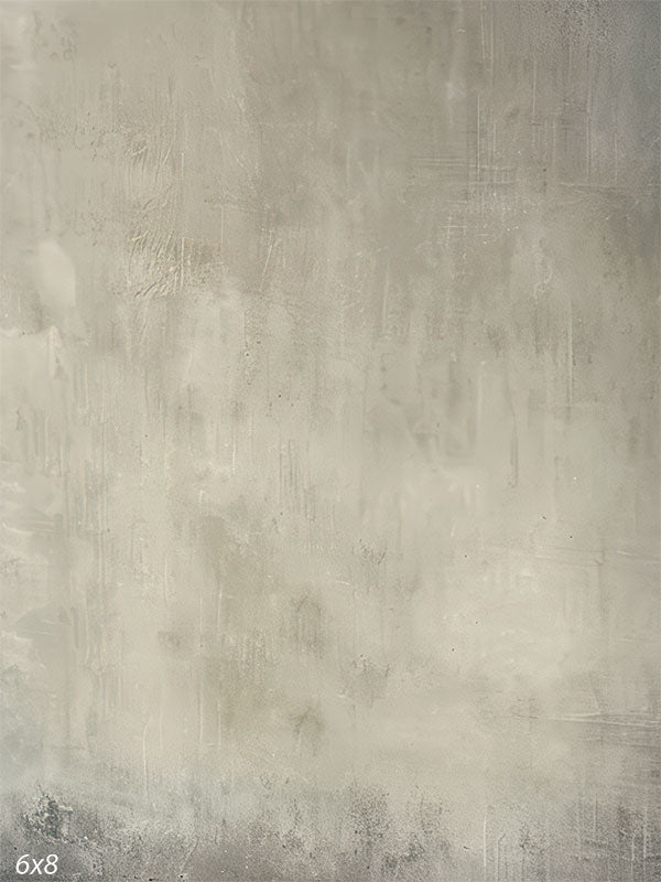 Hand-painted abstract textured backdrop in soft grey tones with a misty finish, ideal for portrait and editorial photography.