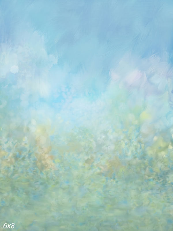Soft watercolor-appearance wash from blue sky into a pale green meadow, a light fine-art photography backdrop.