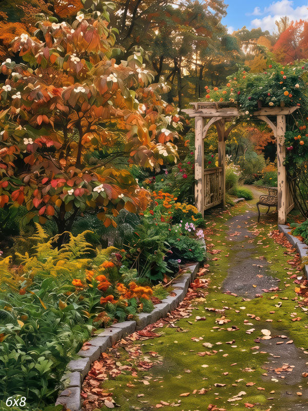 Autumn garden photography backdrop with a moss-edged path leading to a wooden arbor and bench beneath a flowering dogwood and coral and gold borders.