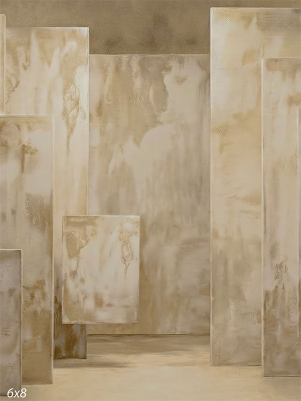 Architectural photography backdrop showing layered beige rectangular panels with plaster-style texture and a continuous studio floor and wall.