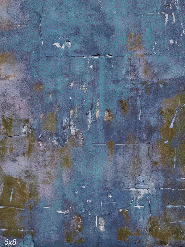 A blue-toned photography backdrop showing a weathered painted wall with layered color, fine cracks, and subtle vertical texture suitable for studio portraits.