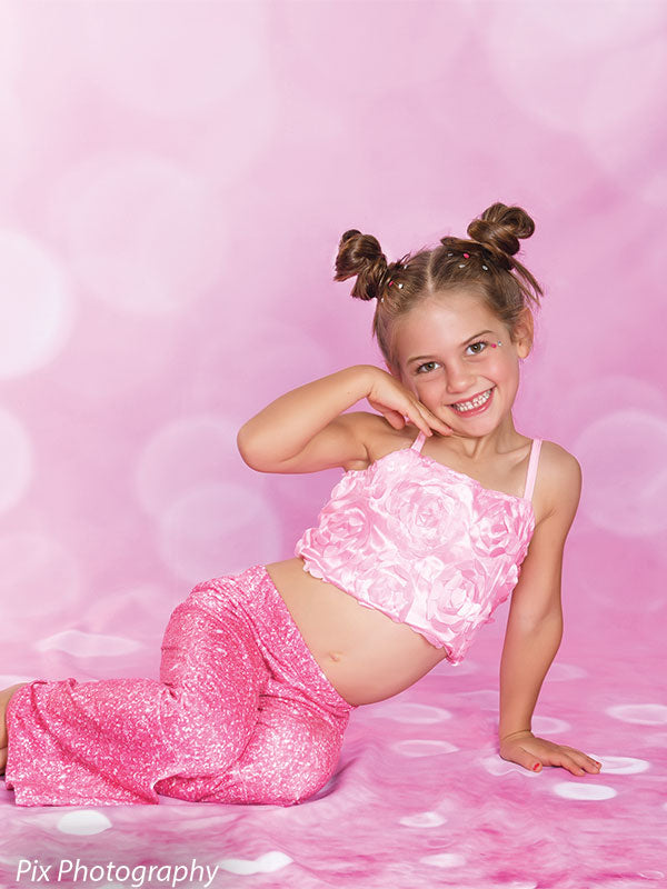 Soft blush pink backdrop with a shimmering bokeh effect, adding a romantic and dreamy ambiance to any photoshoot.