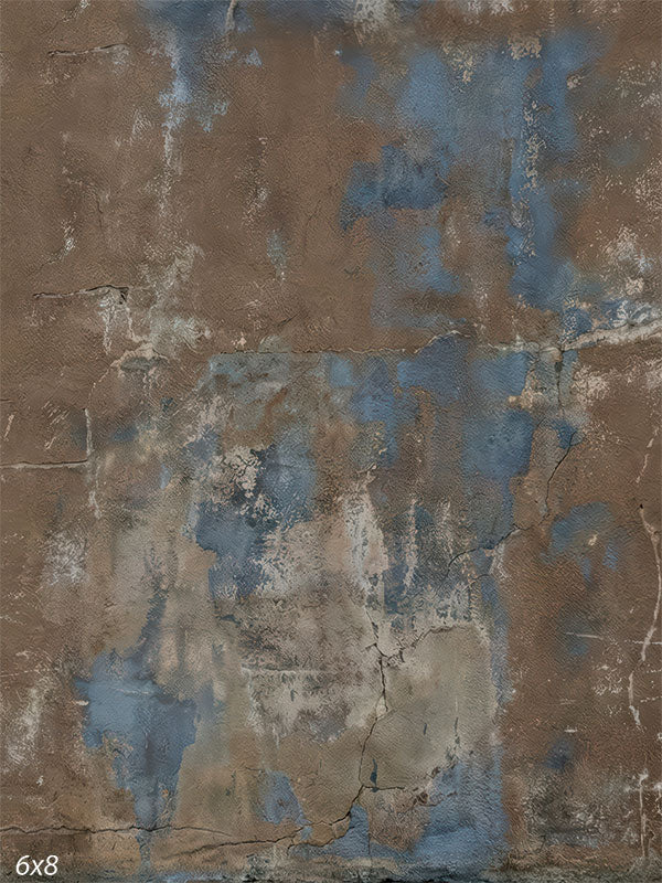 A brown and blue photography backdrop showing a weathered plaster wall with layered color, fine cracks, and organic surface texture for studio portraits.