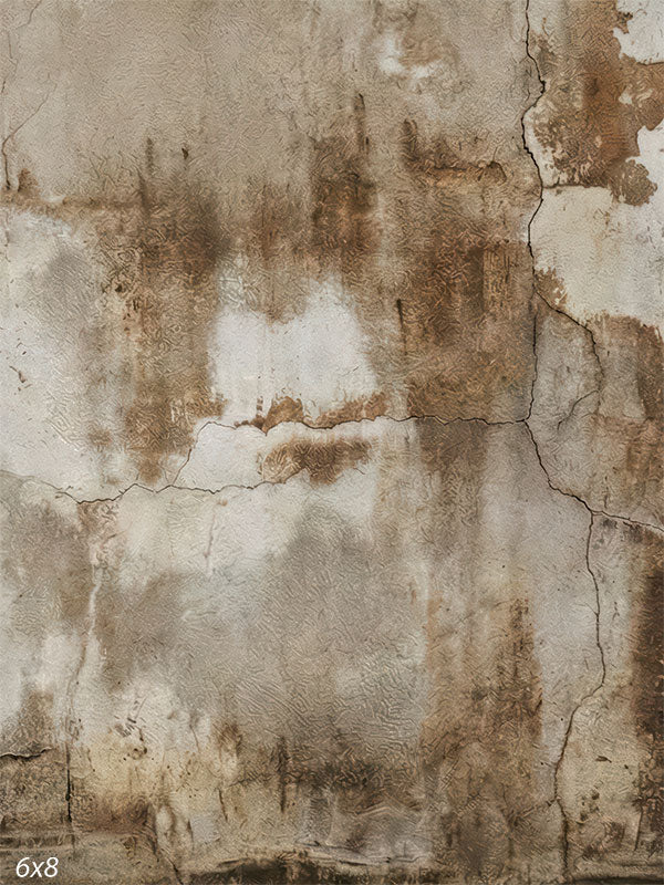 A photography backdrop showing a weathered plaster wall with warm ivory tones, brown staining, fine cracks, and an aged matte surface.