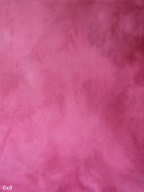 Printed photography backdrop showing vivid magenta-pink, a soft mottled painterly texture with gentle tonal movement.