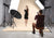 A model poses against a buff seamless paper backdrop, perfect for editorial and lifestyle photography.