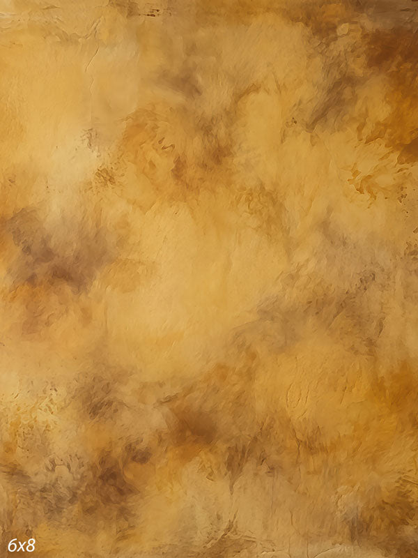 Printed photography backdrop showing golden caramel with darker amber mottling, a soft mottled painterly texture with gentle tonal movement.