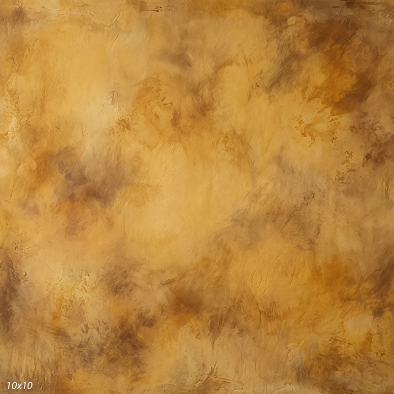 Printed studio background showing a painterly mottled caramel gold texture with a lighter center that deepens toward the edges.