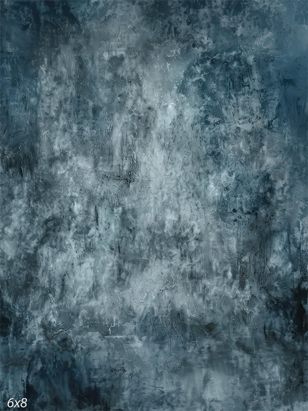 A studio background featuring a dark blue and charcoal grunge texture. The center is lighter and frosted while the edges darken to frame the subject.