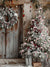 Christmas Winter Cabin Photography Backdrop - Rustic wooden cabin decorated for Christmas with snow-covered tree, candy canes, ornaments, lantern, and presents.