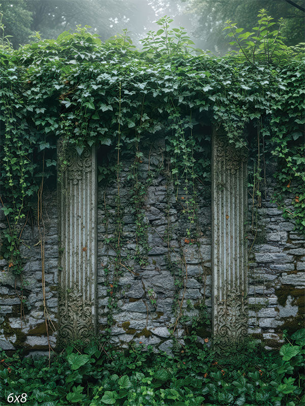 Printed photography backdrop showing a stone garden wall with dense ivy along the top and trailing vines across the surface. Two classical column details and low greenery frame the scene behind a subject.