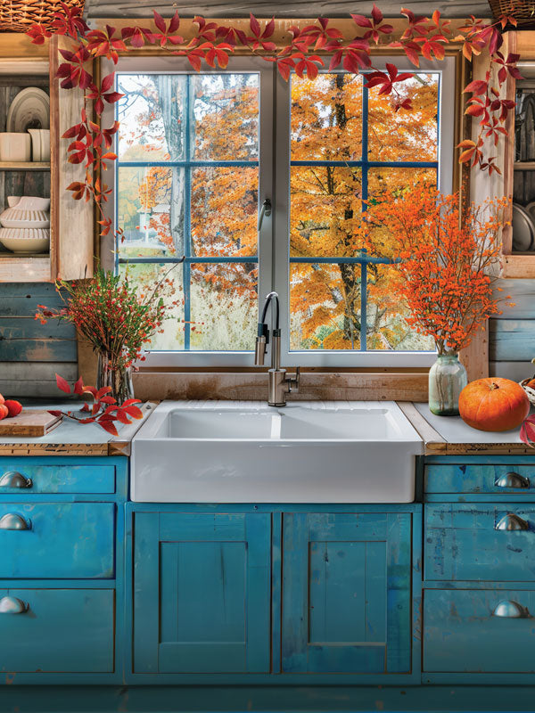 Cozy Autumn Kitchen Photography Backdrop - Photography backdrop featuring a rustic autumn kitchen with blue cabinets, a farmhouse sink, and a window view of fall foliage.