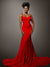 A glamorous portrait session against a dark gray seamless backdrop, perfect for editorial photography.