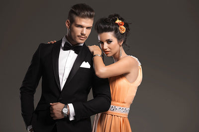 A fashion portrait session featuring a dark gray seamless backdrop for a professional shoot.