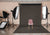 A dark gray seamless paper backdrop in a professional photography studio setting with lighting equipment.