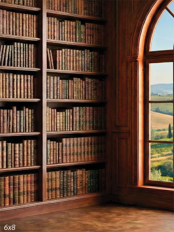 Printed photography backdrop showing a dark wood library bookcase wall with an arched window used behind a portrait subject.