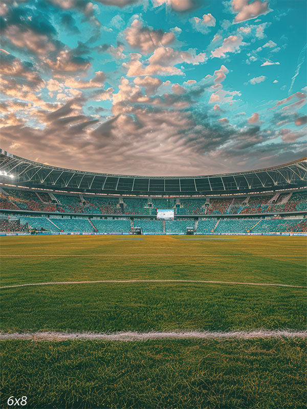 Soccer and football stadium backdrop featuring a green field, crowd-filled stands, and a vibrant daytime sky for sports photography sessions.