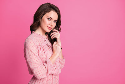A stylish studio setup featuring a deep pink seamless backdrop, perfect for high-fashion and editorial photography.
