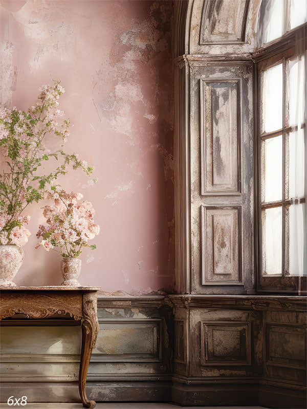 Distressed Pink Wall and Floral Backdrop - Photography backdrop featuring a distressed pink wall with antique wooden accents and floral arrangements.