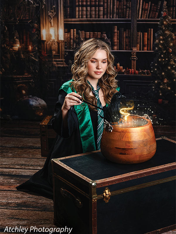 Elegant Victorian holiday bookshelf backdrop adorned with golden ornaments, vintage books, and soft candlelight.