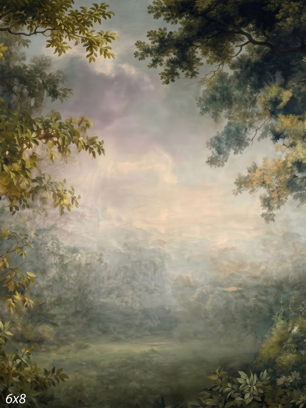 Printed photography backdrop showing a soft, misty forest landscape with a leafy green canopy framing a hazy meadow and a warm, glowing sky.