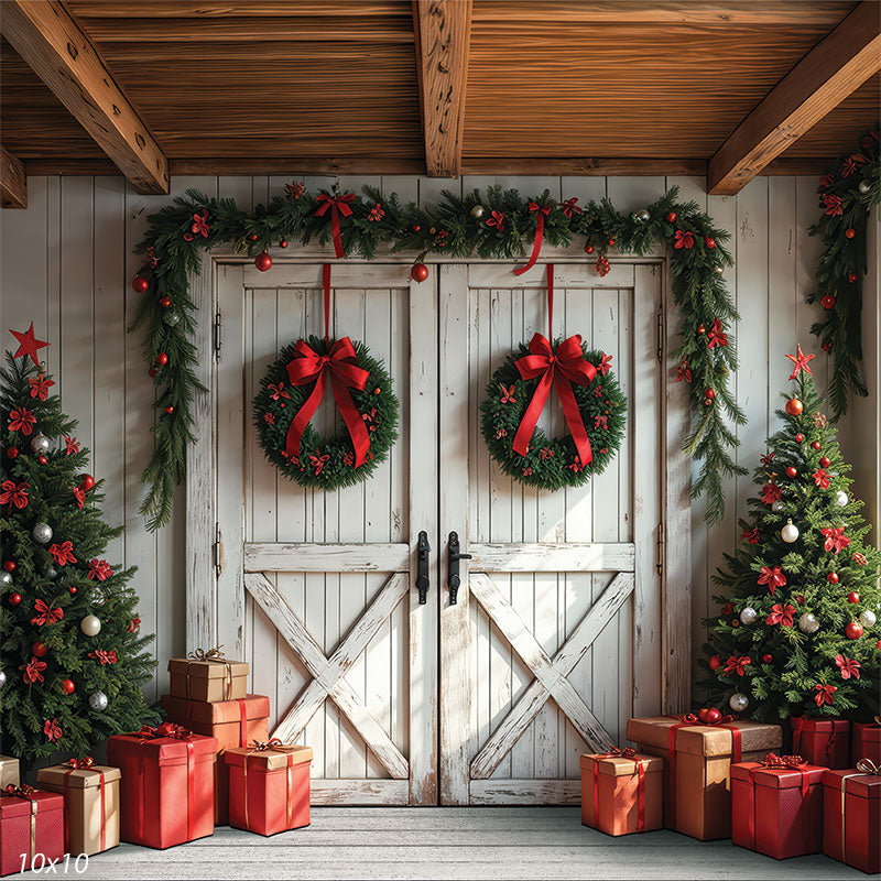 Farmhouse Noel white barn door entry with paired wreaths flanking Christmas trees and holiday gifts backdrop CP-8933
