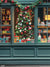 Festive Holiday Storefront Window Photography Backdrop - Festive holiday storefront window display featuring a large Christmas tree with colorful baubles, lights, and ribbons, surrounded by vintage-style toys, gifts, and holiday decorations, all framed by a dark teal wooden storefront frame.