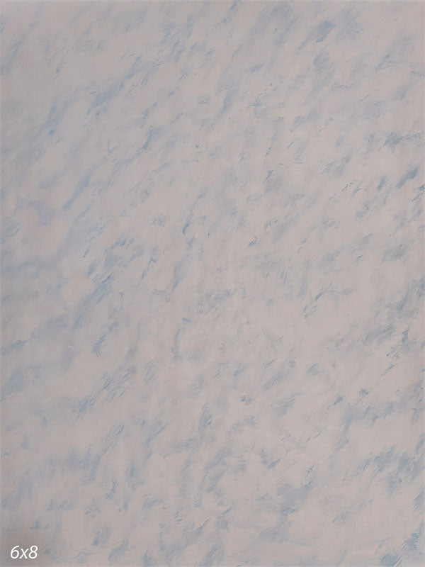 Light, airy hand-painted photography backdrop with pale powder-blue drifting across a bright off-white ground for high-key studio portraits.