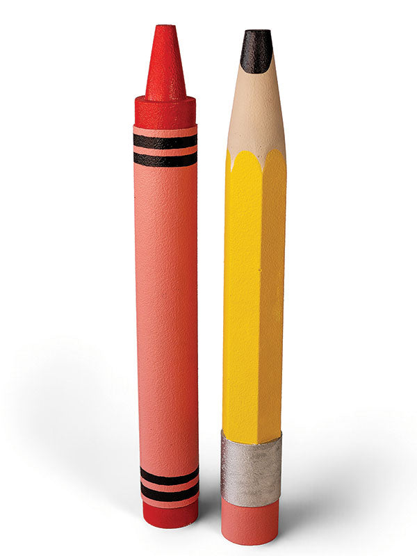 Giant red crayon and sharpened yellow pencil standing upright side by side on a white background, shown as a pair of oversized photography props for back-to-school portraits.