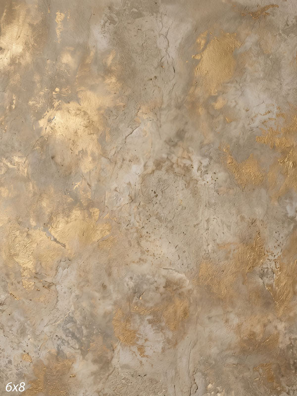 Printed photography backdrop showing sandy tan and taupe with gold flecks, a soft mottled painterly texture with gentle tonal movement.