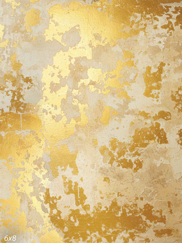 Printed photography backdrop showing a warm tan and beige distressed plaster-style texture with muted gold-toned patches. The surface reads as soft, non-directional texture behind a subject.