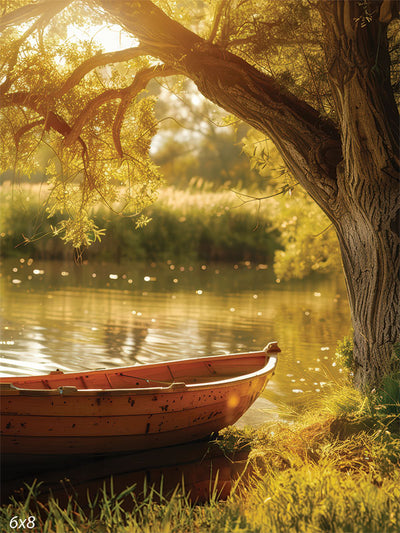 Golden Sunset Rowboat Photography Backdrop - Photography backdrop of a wooden rowboat on a sunlit lake, framed by a large tree, perfect for outdoor nature-themed photoshoots.