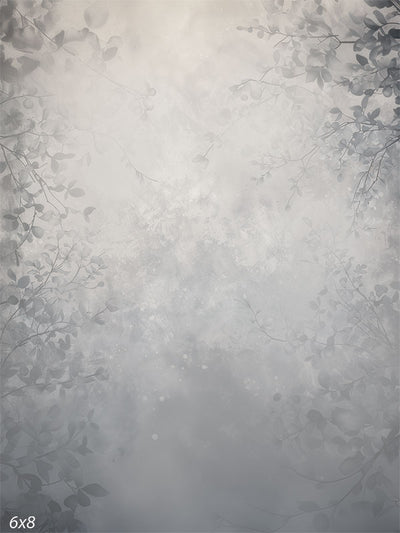 Soft gray photography backdrop with delicate branches and a misty floral pattern for professional use.