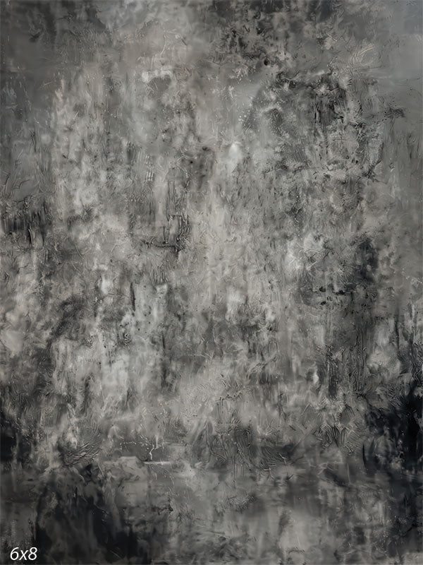 A studio background featuring a monochromatic gray surface with heavy grunge textures and scratch marks. The center is lighter while the edges darken to frame the subject.