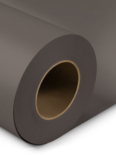 Close-up of a rolled gray medium seamless photography backdrop, designed for studio, portrait, and product photography.