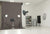 A gray medium seamless photography backdrop in a professional studio setting, perfect for fashion, portraits, and commercial shoots.