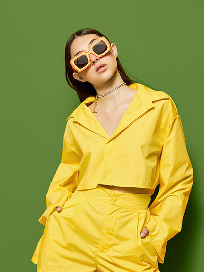 A fashion photoshoot against a green screen backdrop, perfect for professional photography and digital editing.