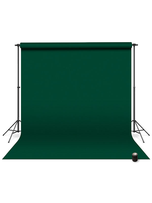 Pine green seamless photography backdrop paper mounted on a stand for studio photography and video production.