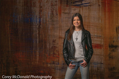 Abstract grunge backdrop with fused heat tones in red, gold, and burnt brown.