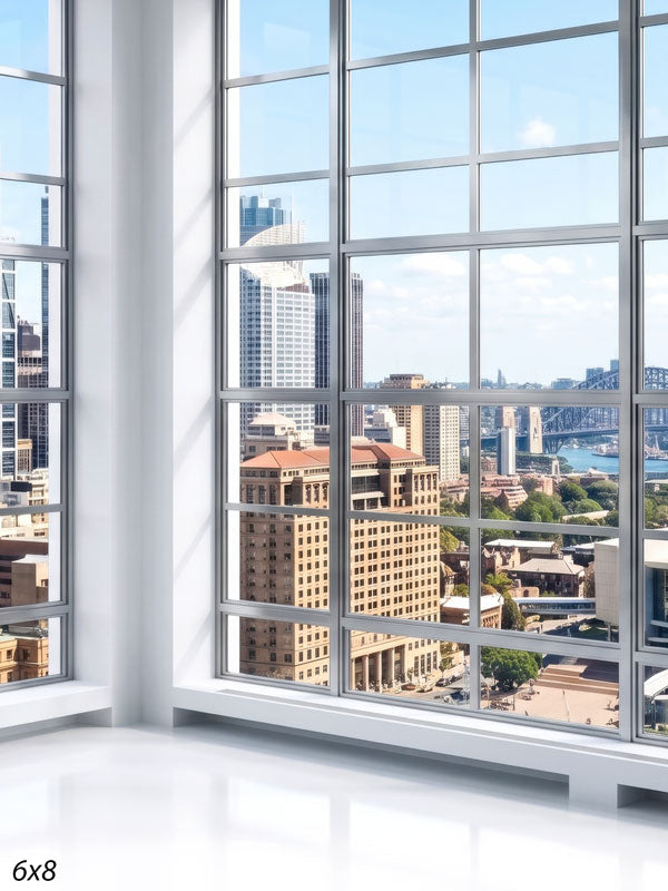 Bright white-gridded window corner overlooking a sunlit harbor city with an arched bridge and blue water, a city view photography backdrop.