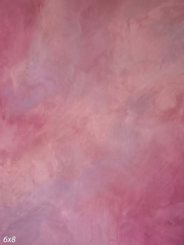 Printed photography backdrop showing muted faded rose and mauve, a soft mottled painterly texture with gentle tonal movement.