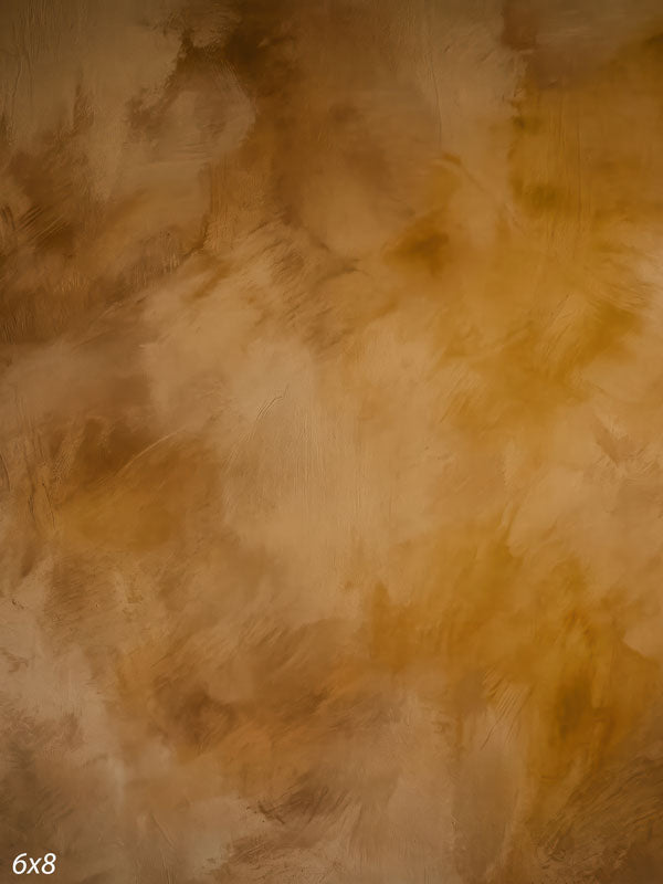 Printed photography backdrop showing warm amber and honey gold, a soft mottled painterly texture with gentle tonal movement.