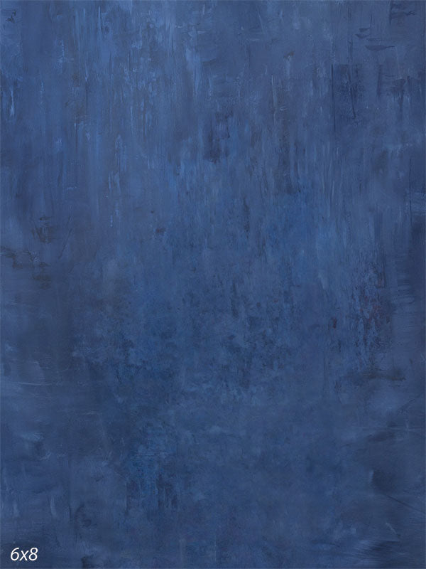 Deep navy hand-painted photography backdrop with a softly distressed, washed finish in charcoal and muted blue for low-key studio portraits.