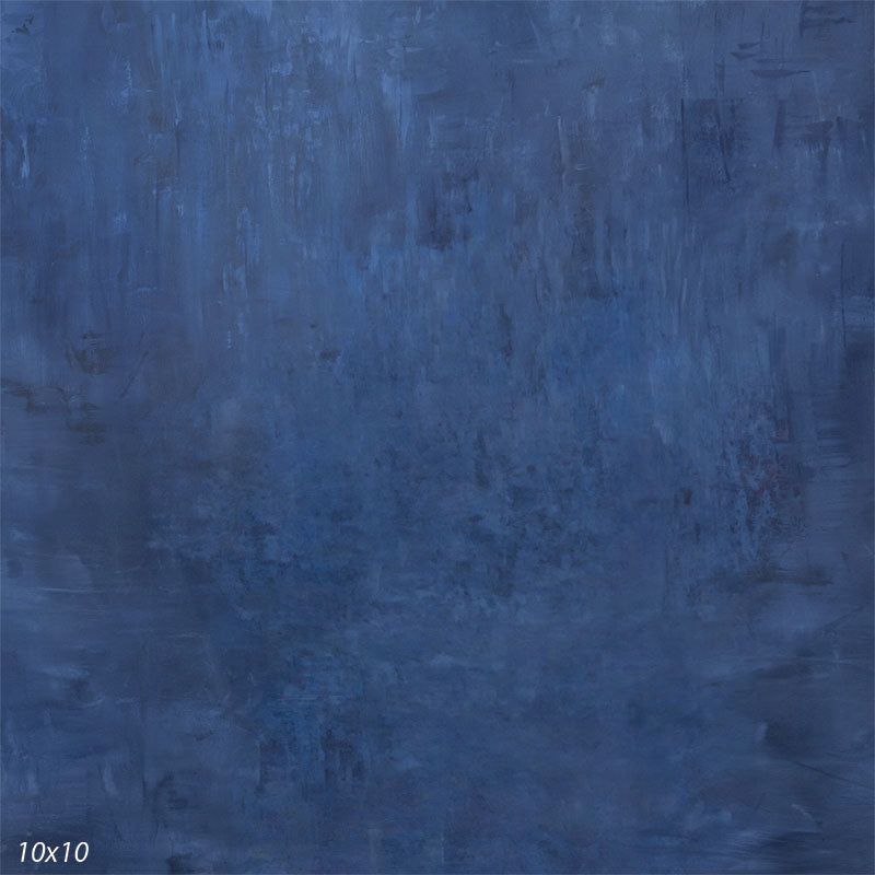 Deep navy hand-painted photography backdrop with a softly distressed, washed finish in charcoal and muted blue for low-key studio portraits.