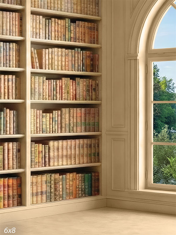 Printed photography backdrop showing an ivory bookcase wall with vintage books and an arched window detail used behind a portrait subject.