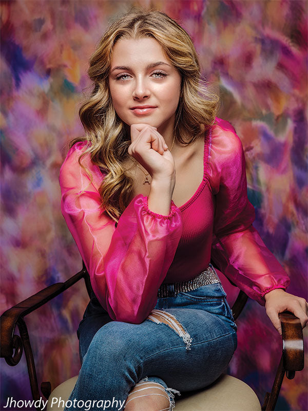 A visually rich backdrop in shades of lavender, coral, and blush, ideal for artistic portraits.