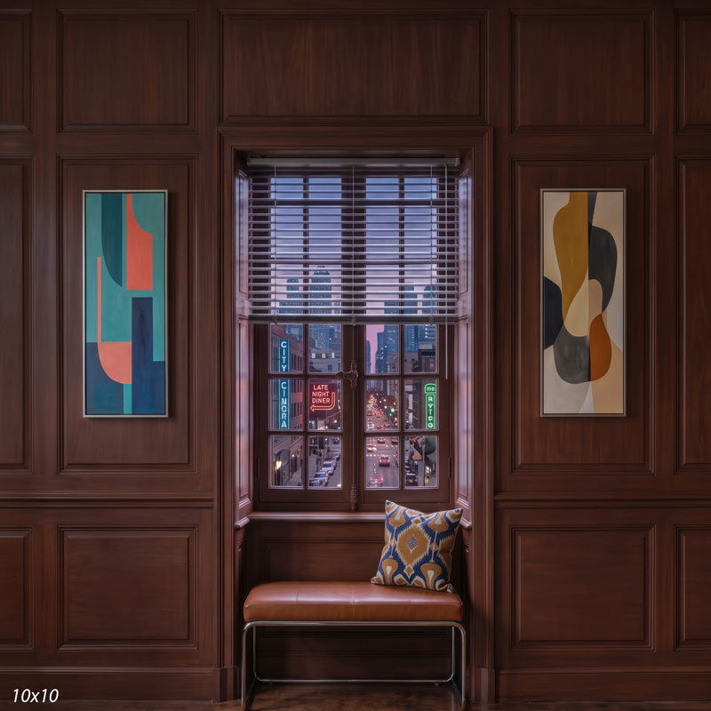 Wider view of the paneled room showing framed abstract art panels on both sides of the window and more of the dusk city street beyond, a city view photography backdrop.