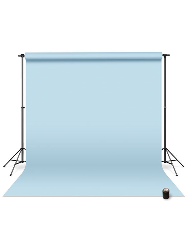 Light blue seamless photography backdrop paper mounted on an adjustable stand for professional studio use.