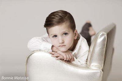 Modern light gray backdrop with metallic chair—ideal for school, family, or milestone child portraits.