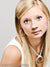Clean gray studio background in close-up senior portrait—great for professional headshots and portfolio work.